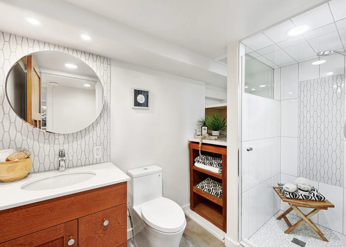 Bathroom vanity and shower area in the renovated home
