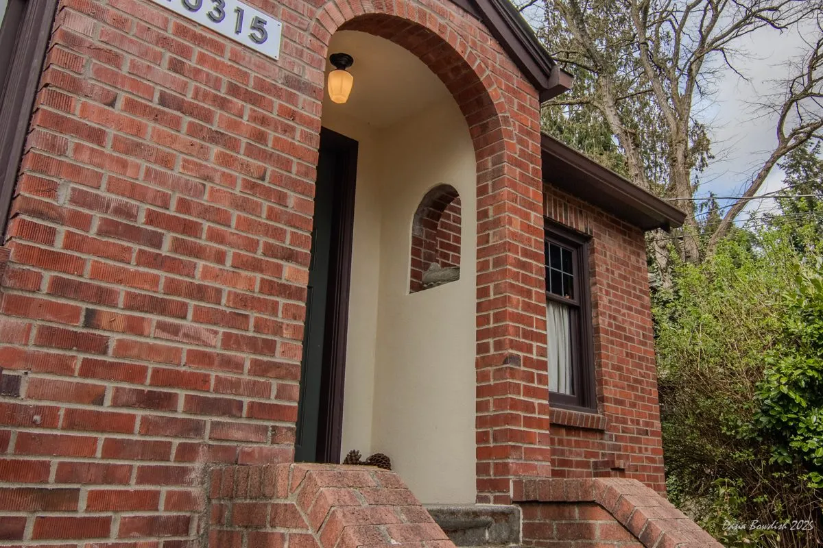 Gables, stucco, and detailed trim rebuilt with care