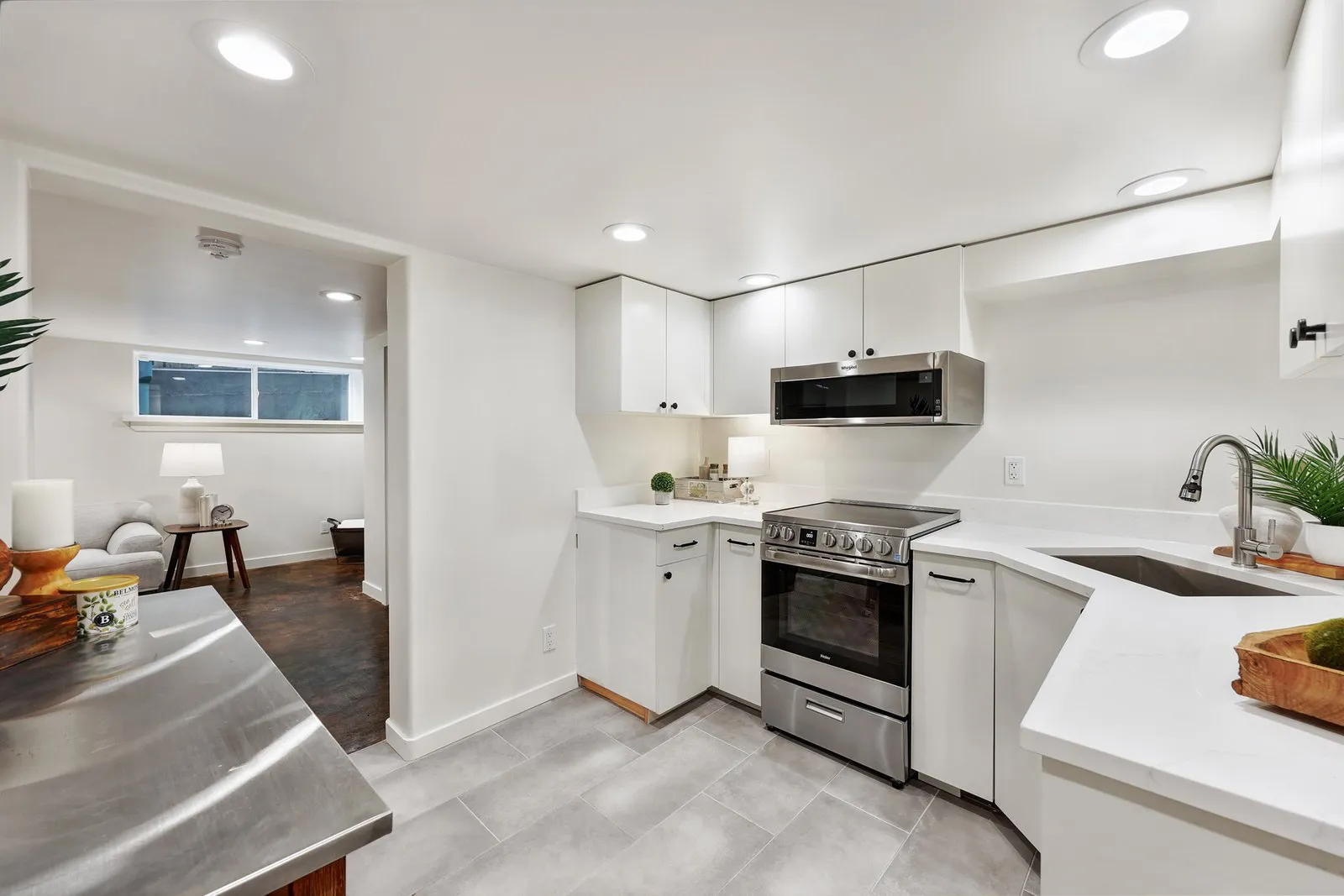 Kitchen design with efficient layout, white cabinetry, and modern finishes
