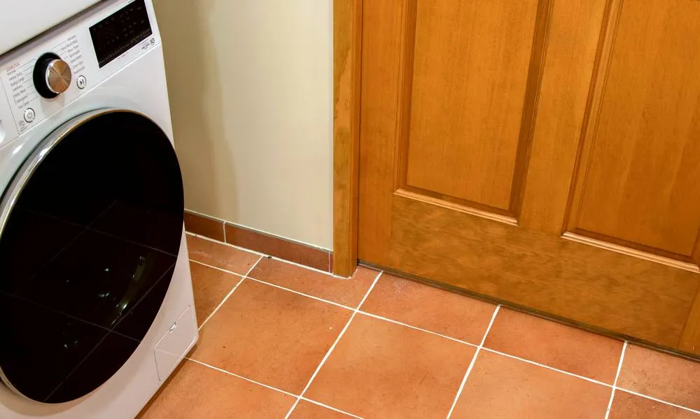 Laundry appliance integrated into the Greenwood bathroom and laundry renovation