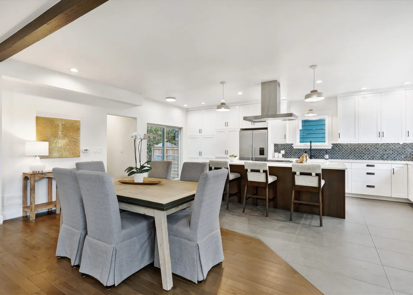 Open-concept living, dining, and kitchen area
