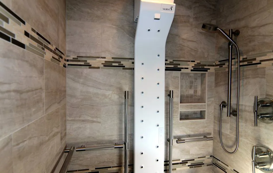 Primary shower with in-shower dryer, two shower heads, and accessible details