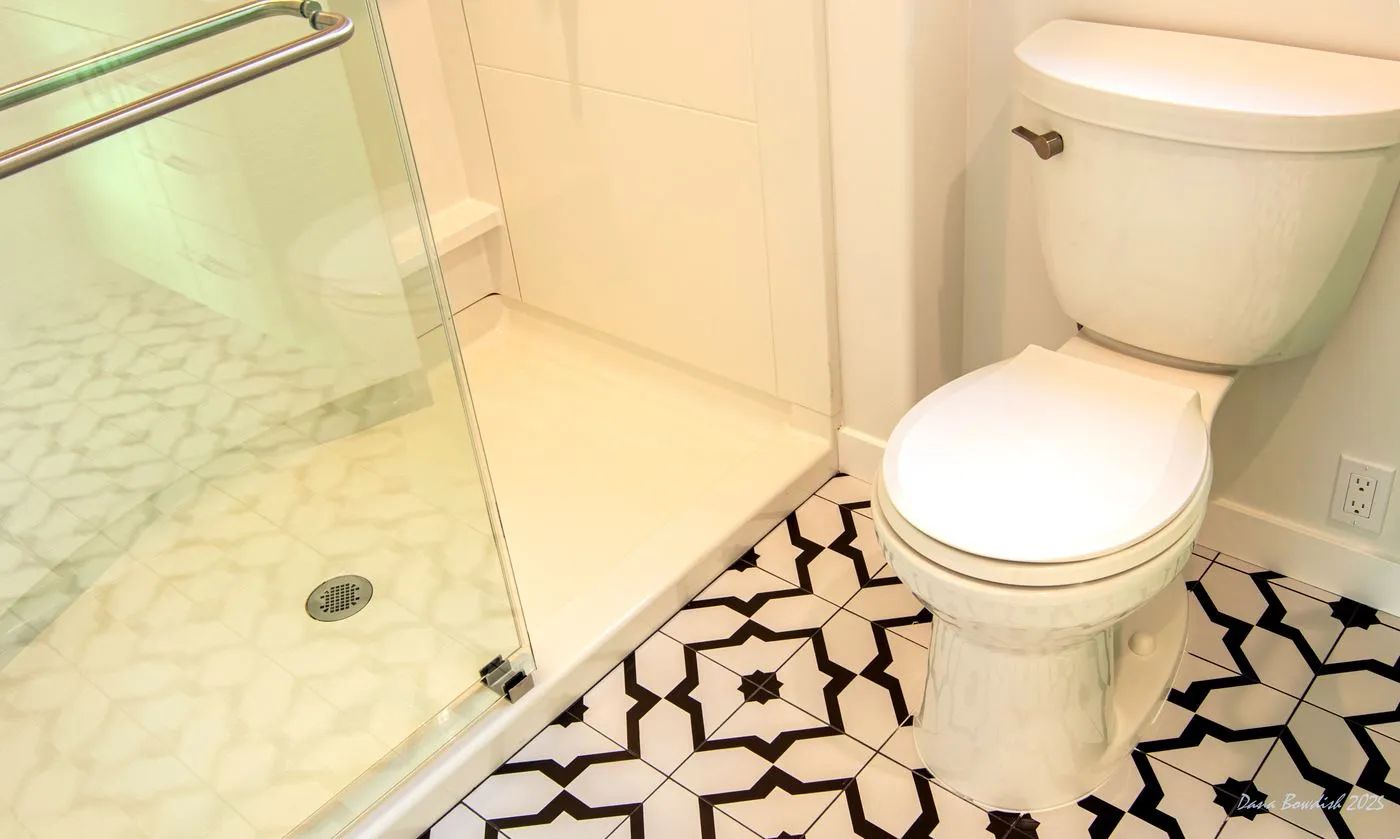 Shower and patterned floor tile detail in the DADU bathroom