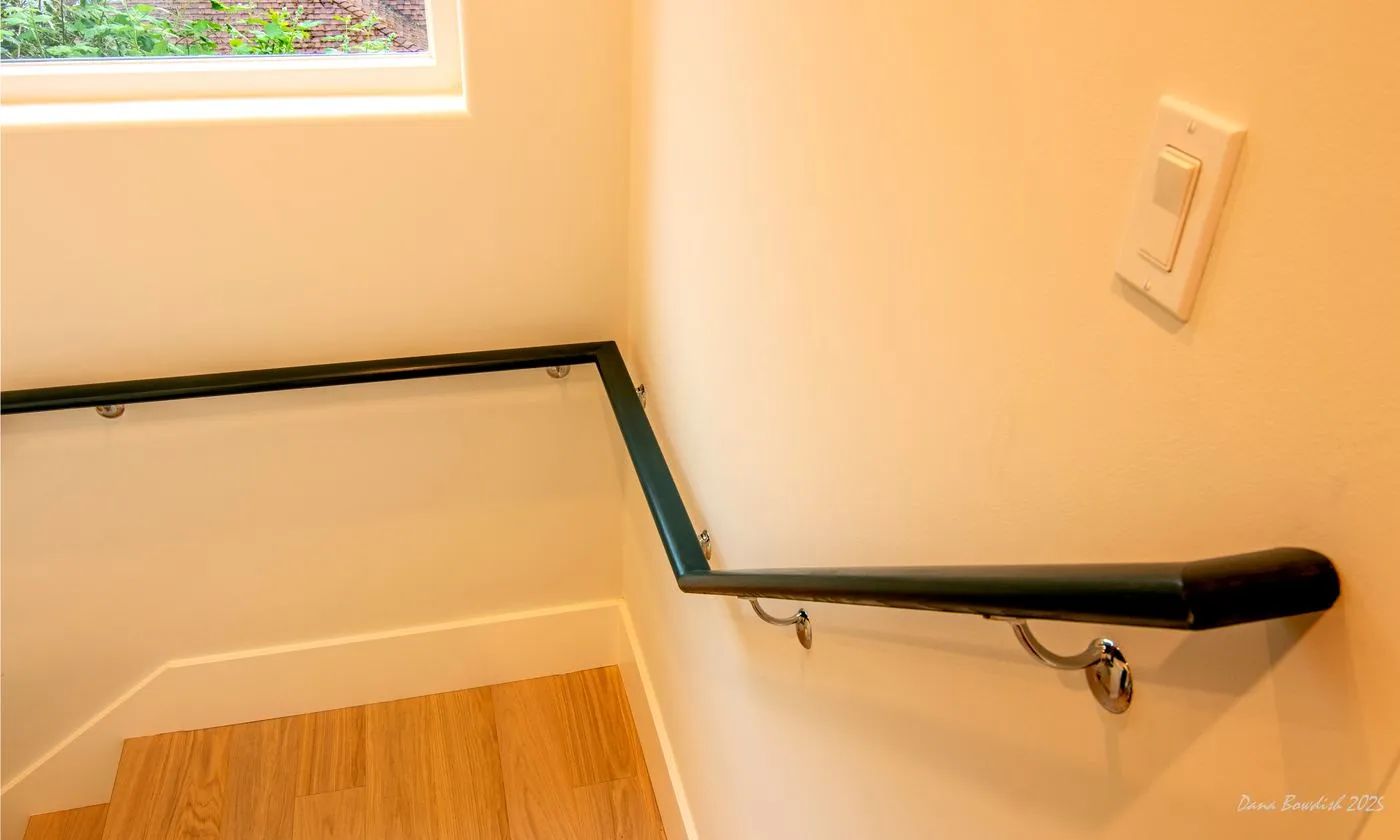 Stair and handrail detail showing the compact circulation layout
