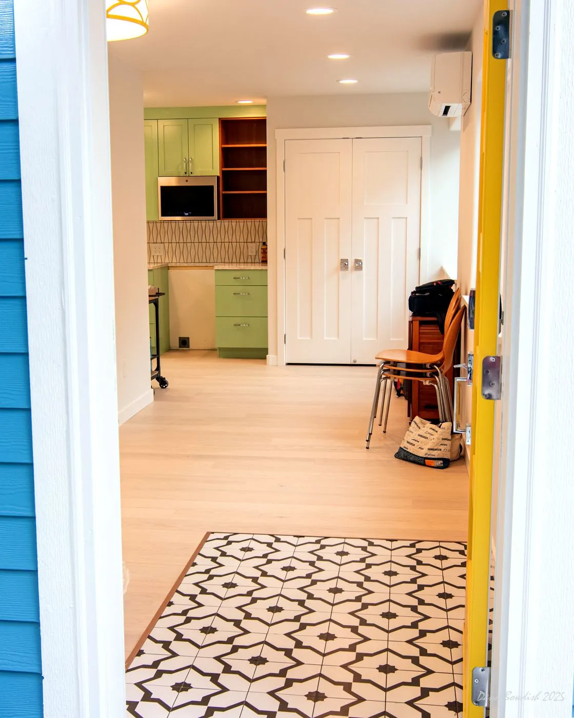 View from the entry toward the living area and kitchen
