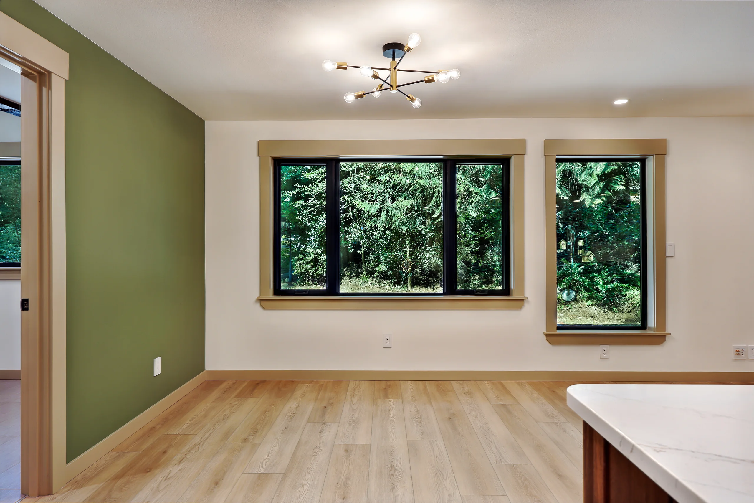 Living room with large windows and wood flooring